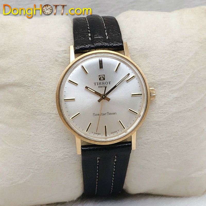 Mặt lưng đồng hồ Tissot cổ điển với dấu khắc vàng 18K, chứng nhận chất lượng