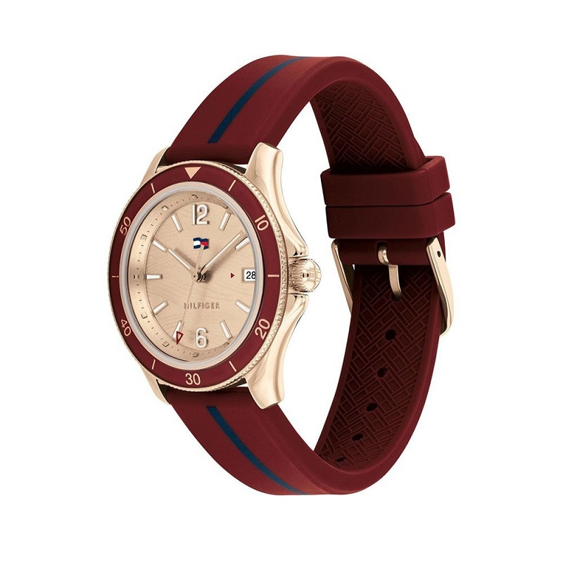 Đồng hồ nữ Tommy Hilfiger mặt số vàng hồng 38mm, dây da nâu, đeo trên cổ tay nữ